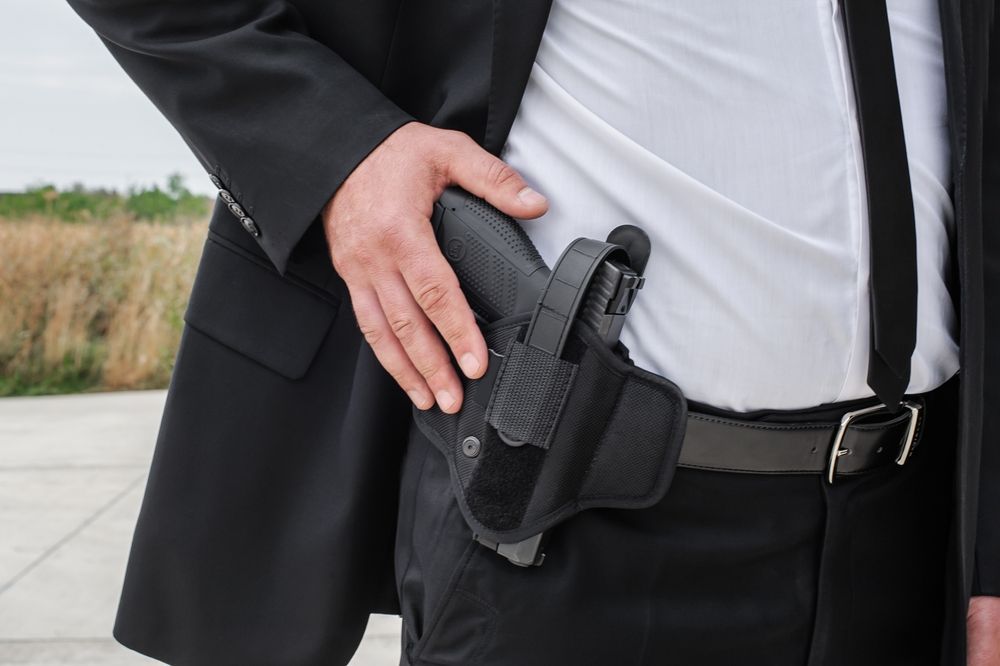 a man with a holster on his belt