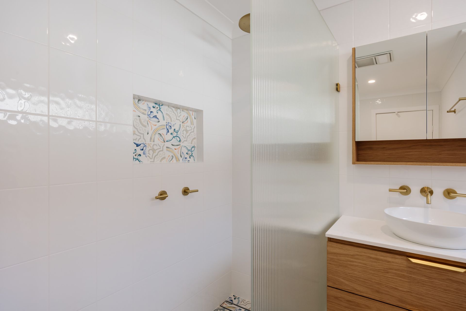 Modern bathroom renovation in Teralba completed by Suncoast Bathrooms featuring a freestanding vanity, premium fixtures and contemporary finishes