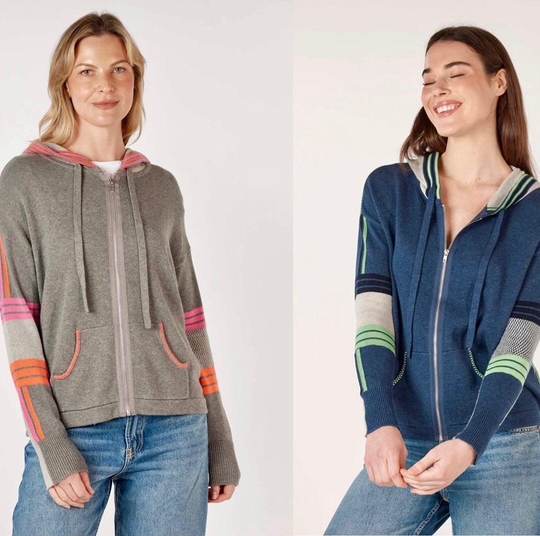 Two Women Wearing Hoodies Are Standing Next to Each Other — Onyx Poppy Boutique in Sunshine Coast, QLD