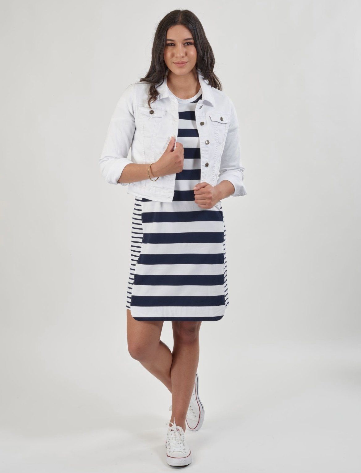 A Woman is Wearing a Striped Dress and Jacket — Onyx Poppy Boutique in Buderim, QLD