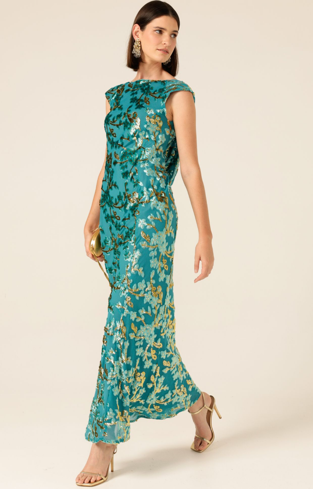 Woman in a Navy Blue Dress with Bell Sleeves Poses Smiling — Onyx Poppy Boutique in Sunshine Coast, QLD