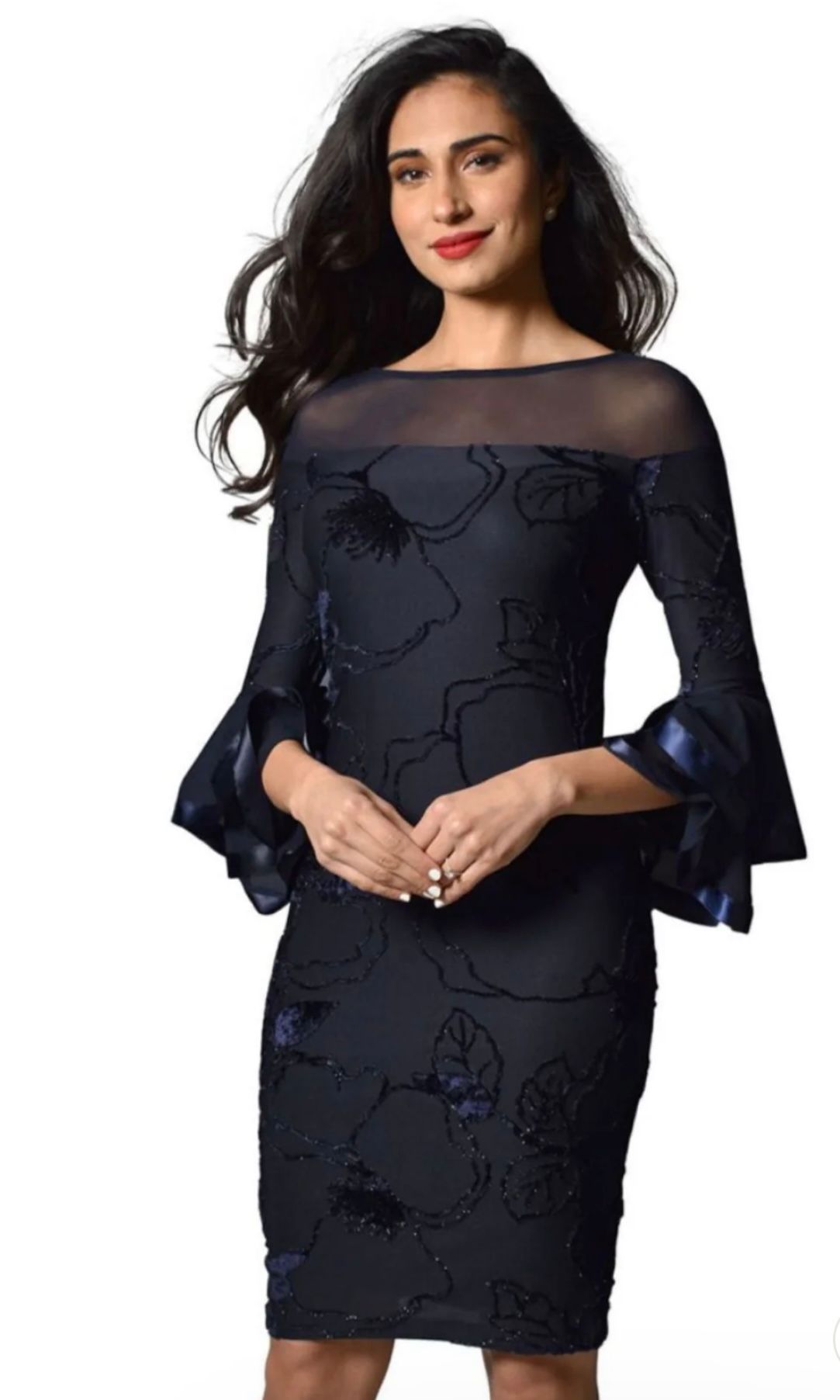 Woman in a Navy Blue Dress With Floral Embroidery, Sheer Neckline, and Bell Sleeves — Onyx Poppy Boutique in Buderim, QLD