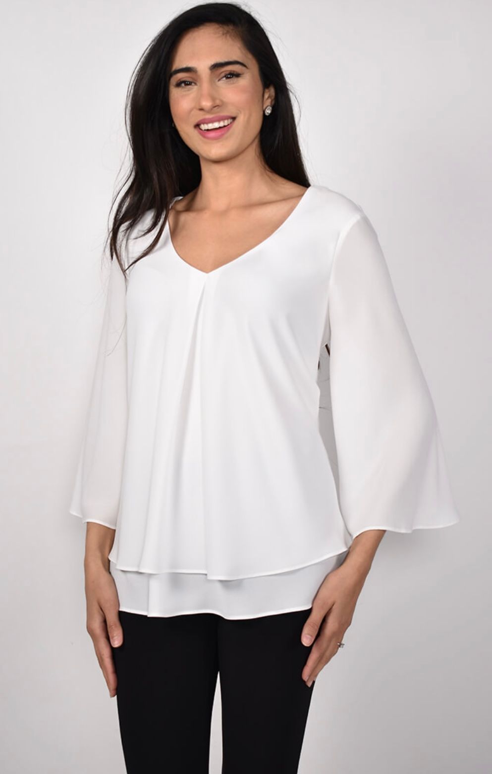 Woman Wearing a White Blouse With Flared Sleeves — Onyx Poppy Boutique in Buderim, QLD