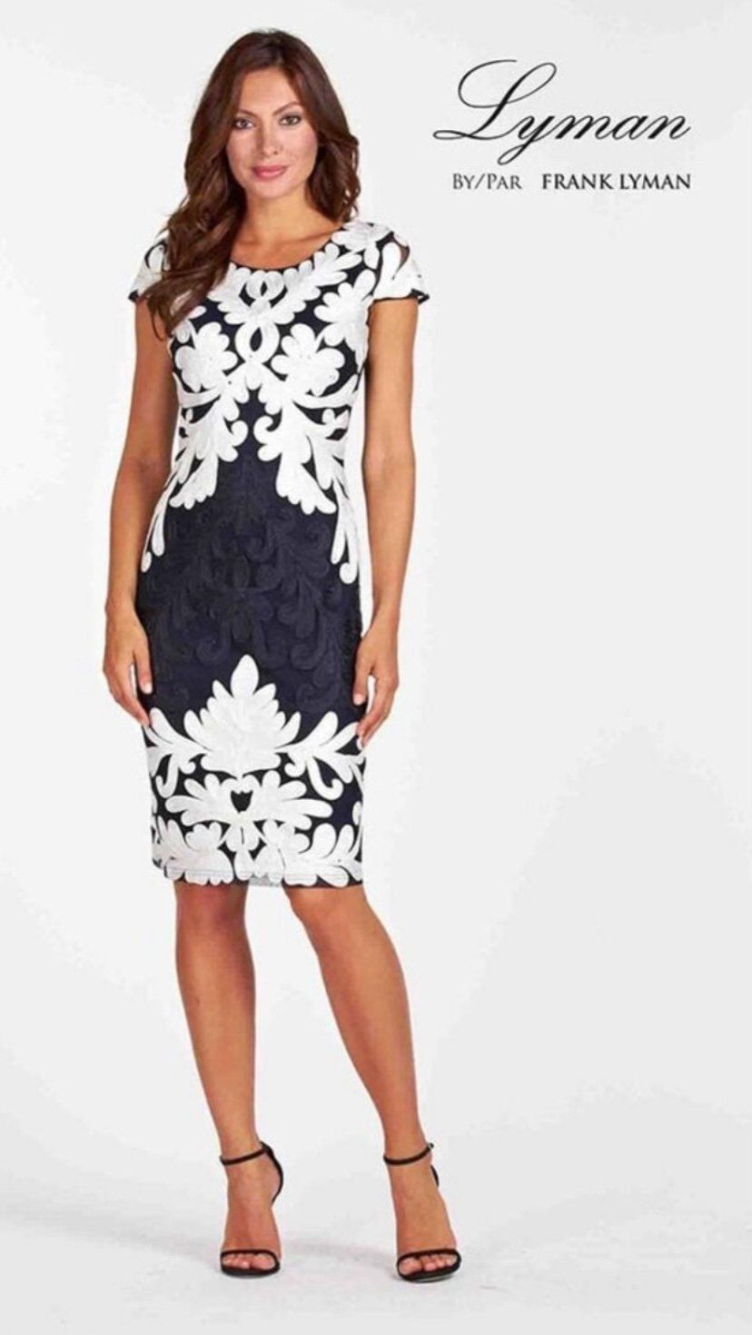 A Woman is Wearing a Black and White Dress and Heels — Onyx Poppy Boutique in Buderim, QLD