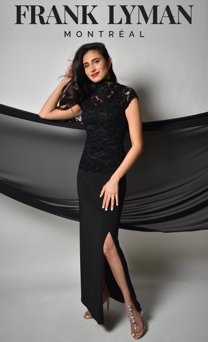 A Woman is Wearing a Black Dress — Onyx Poppy Boutique in Buderim, QLD