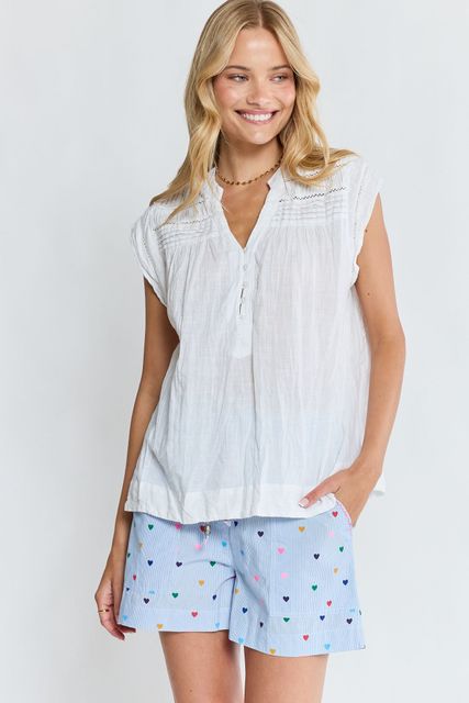 A Woman in a Floral Dress is Standing on a Sidewalk — Onyx Poppy Boutique in Buderim, QLD