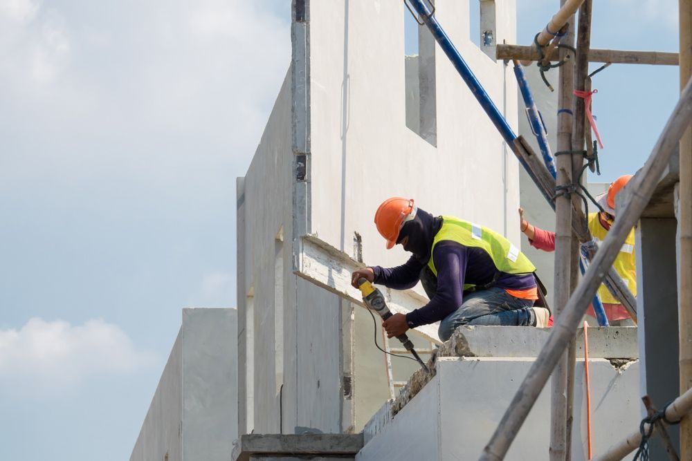 Group Of Construction Builders Working On A Concrete — Precast Concrete Solutions in Queanbeyan East, NSW