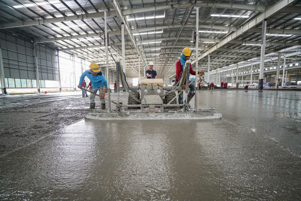 Group Of Construction Builders Working On A Concrete — Precast Concrete Solutions in Sydney, NSW