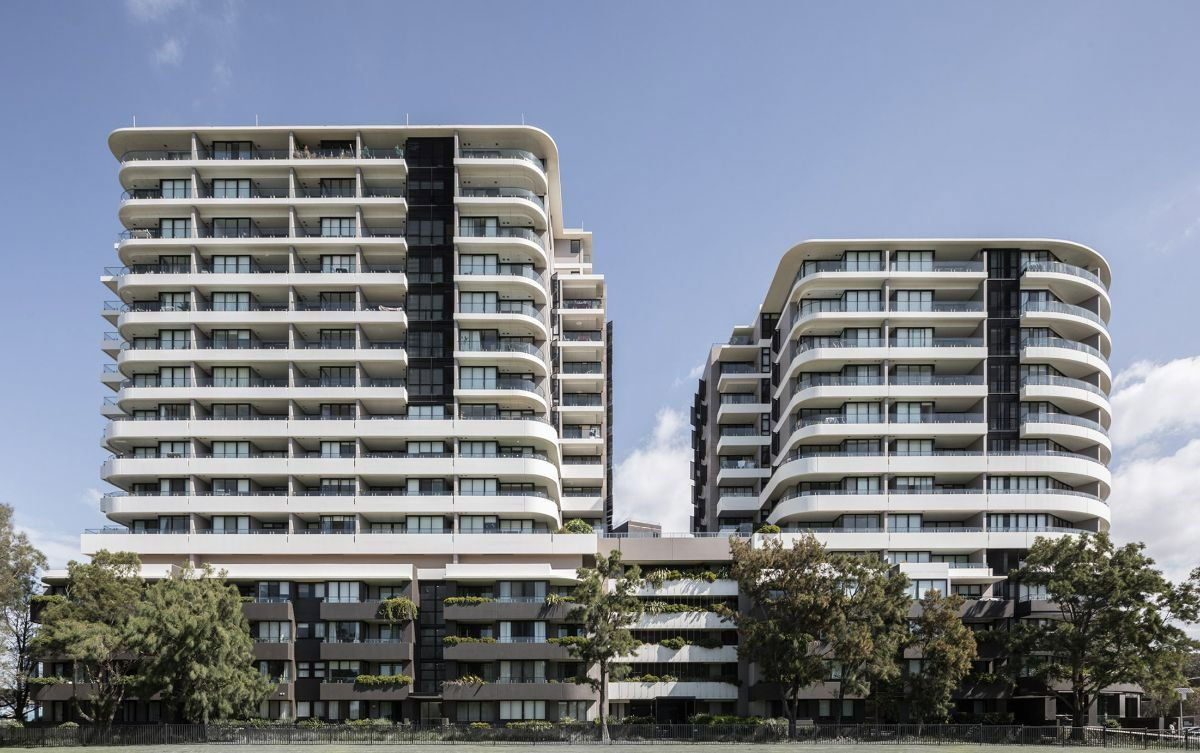 A Couple of Tall Buildings Sitting next to each other on a sunny day — Precast Concrete Solutions in Queanbeyan East, NSW