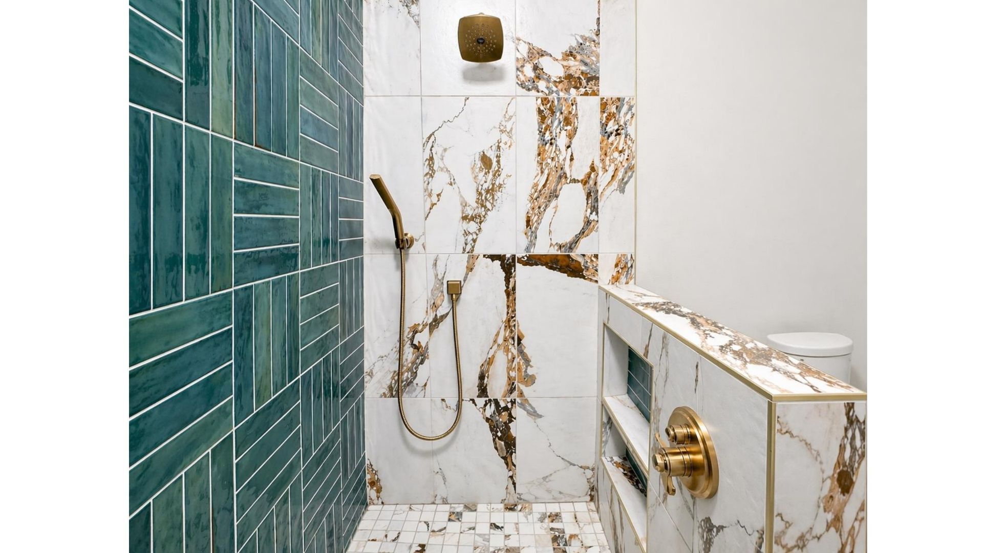 White-and-gold marble bathroom with teal tile walls, brass fixtures, and a built-in tub ledge.