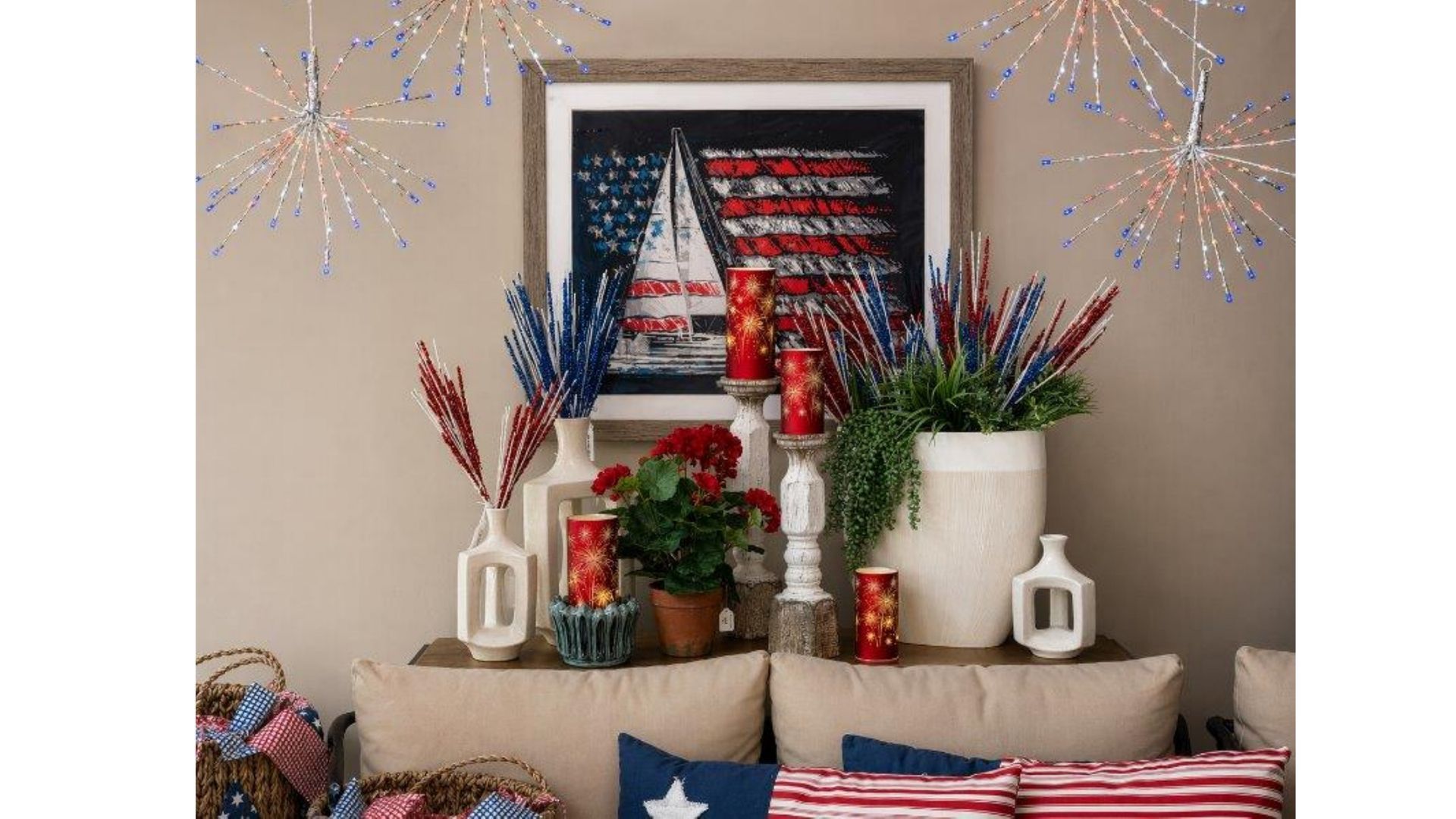 Patriotic living room mantel with American flag art, red-white-blue decor, and potted plants