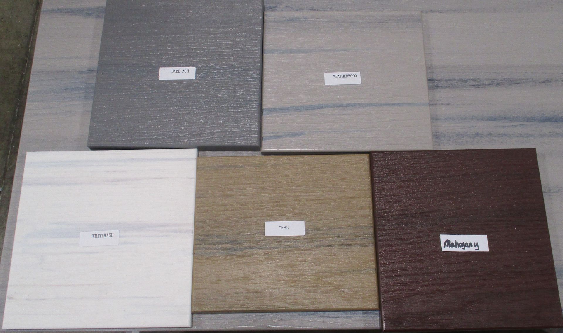 Six square stone tile samples of varying colors and textures.