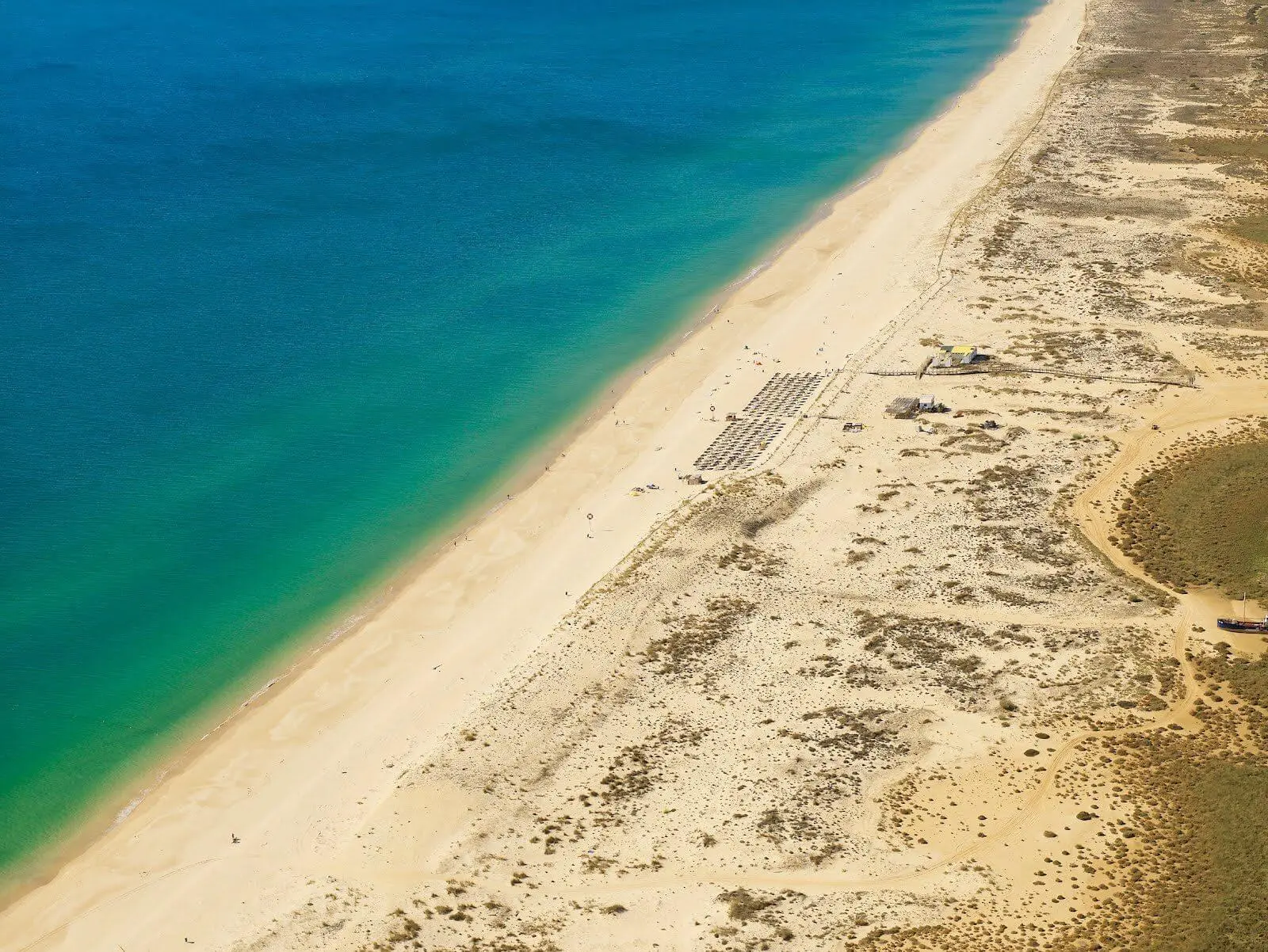 beach in Cabanas Tavira, blue water.