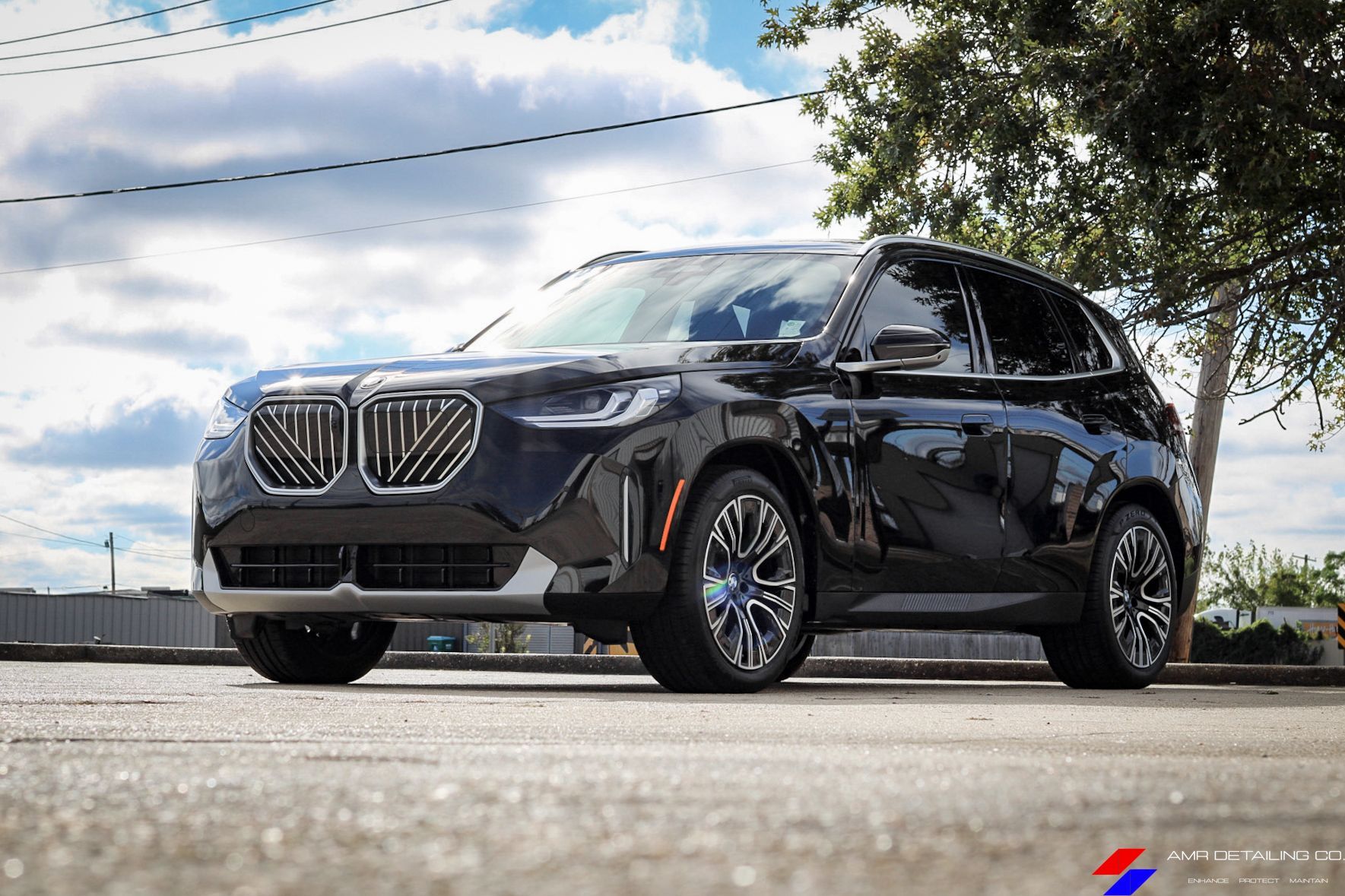 BMW X3 front end with glossy paint after ceramic coating protection
