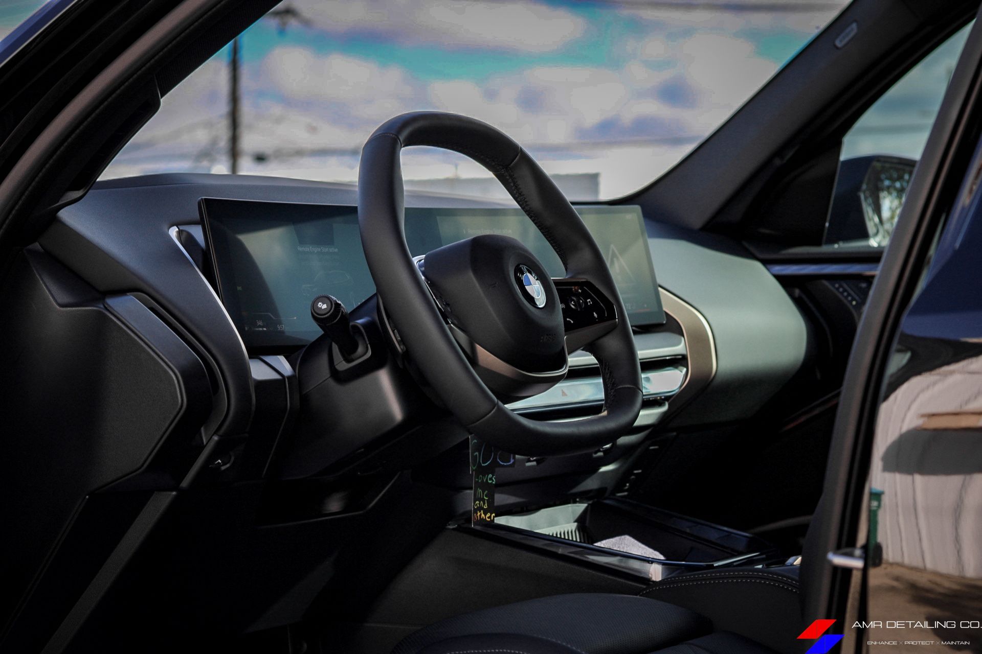 BMW X3 interior showing modern dashboard and steering wheel

