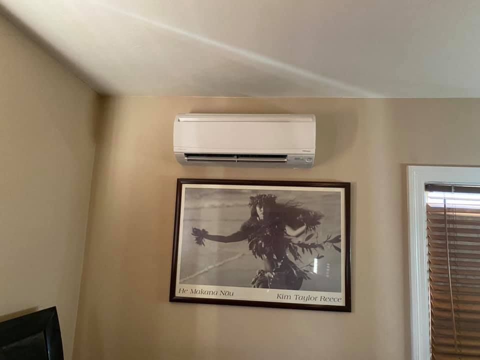 Indoor air conditioning installation with ductless mini-split system and HVAC indoor air quality improvement
