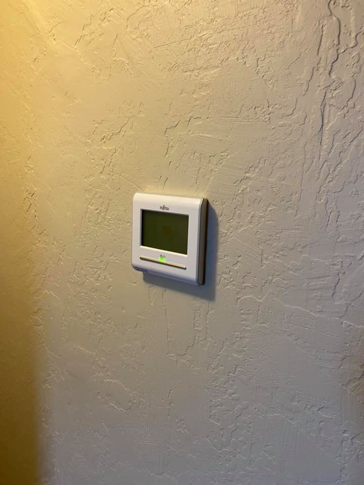 Installed digital thermostat for air conditioning thermostat replacement and HVAC heating control
