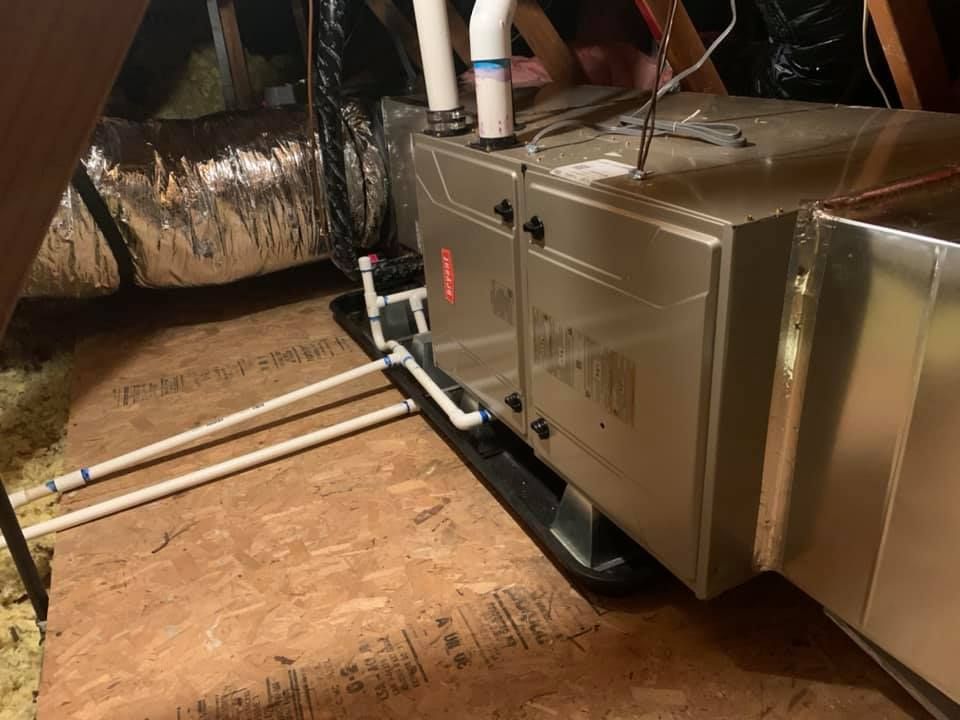 Bryant furnace installed in attic with drain lines and drain pan by RPM HVAC Service Inc.