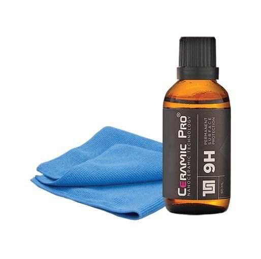 Blue microfiber cloth beside amber ceramic coating bottle labeled “9H”