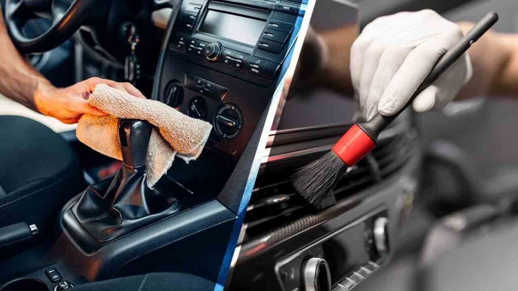 Car interior being cleaned: one hand wipes dashboard, another uses a vacuum nozzle on vents.
