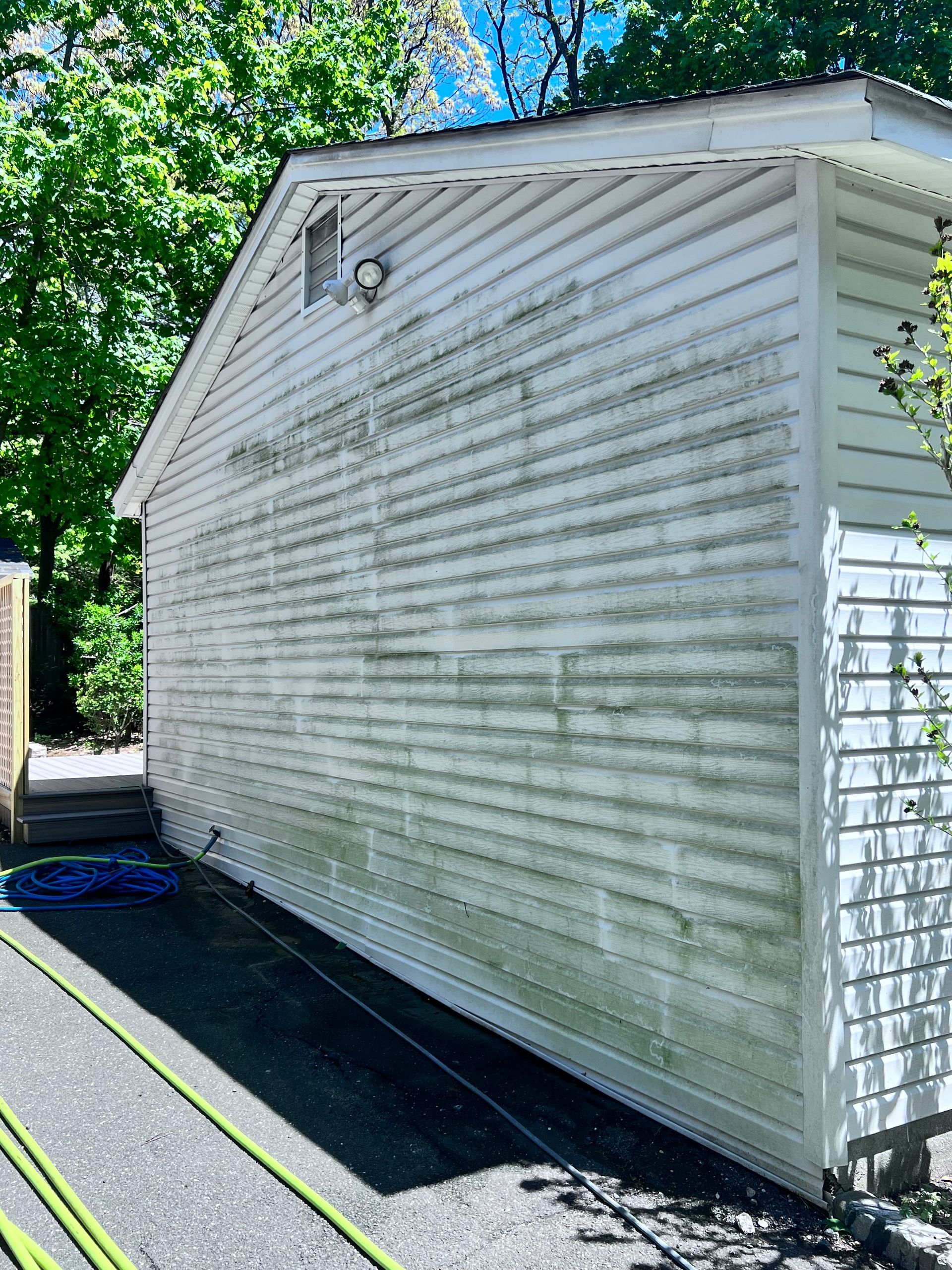 Image showing vinyl siding with mildew growth, highlighting the need for cleaning and maintenance.