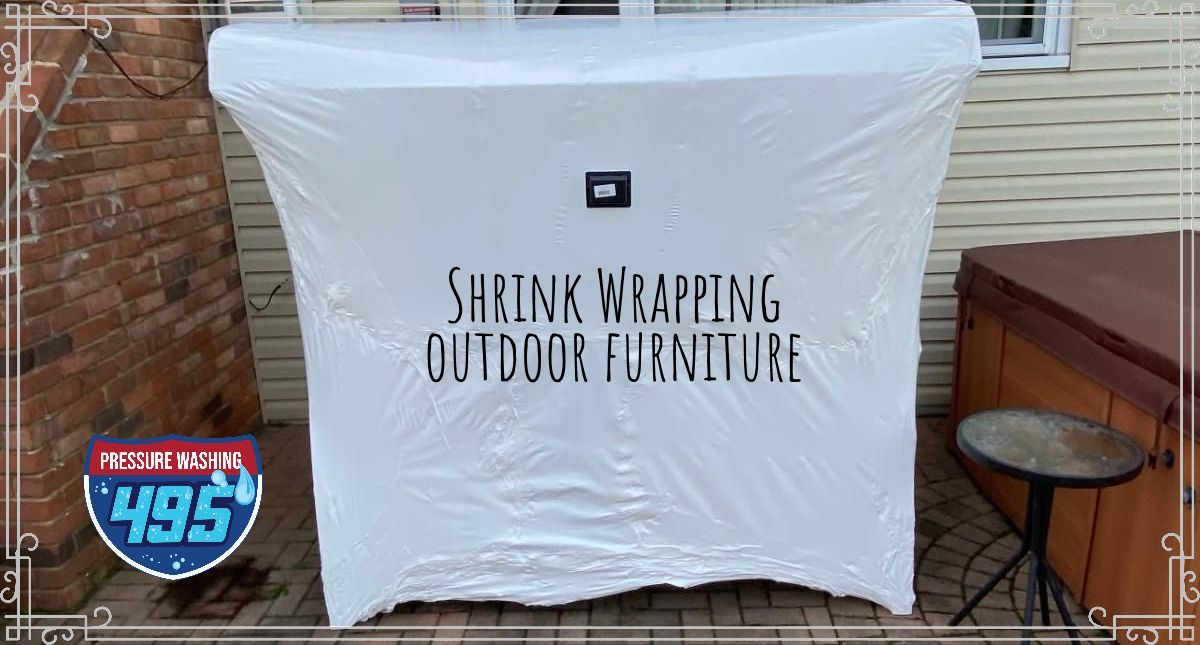 White cabinet shrink-wrapped for outdoor storage, with text