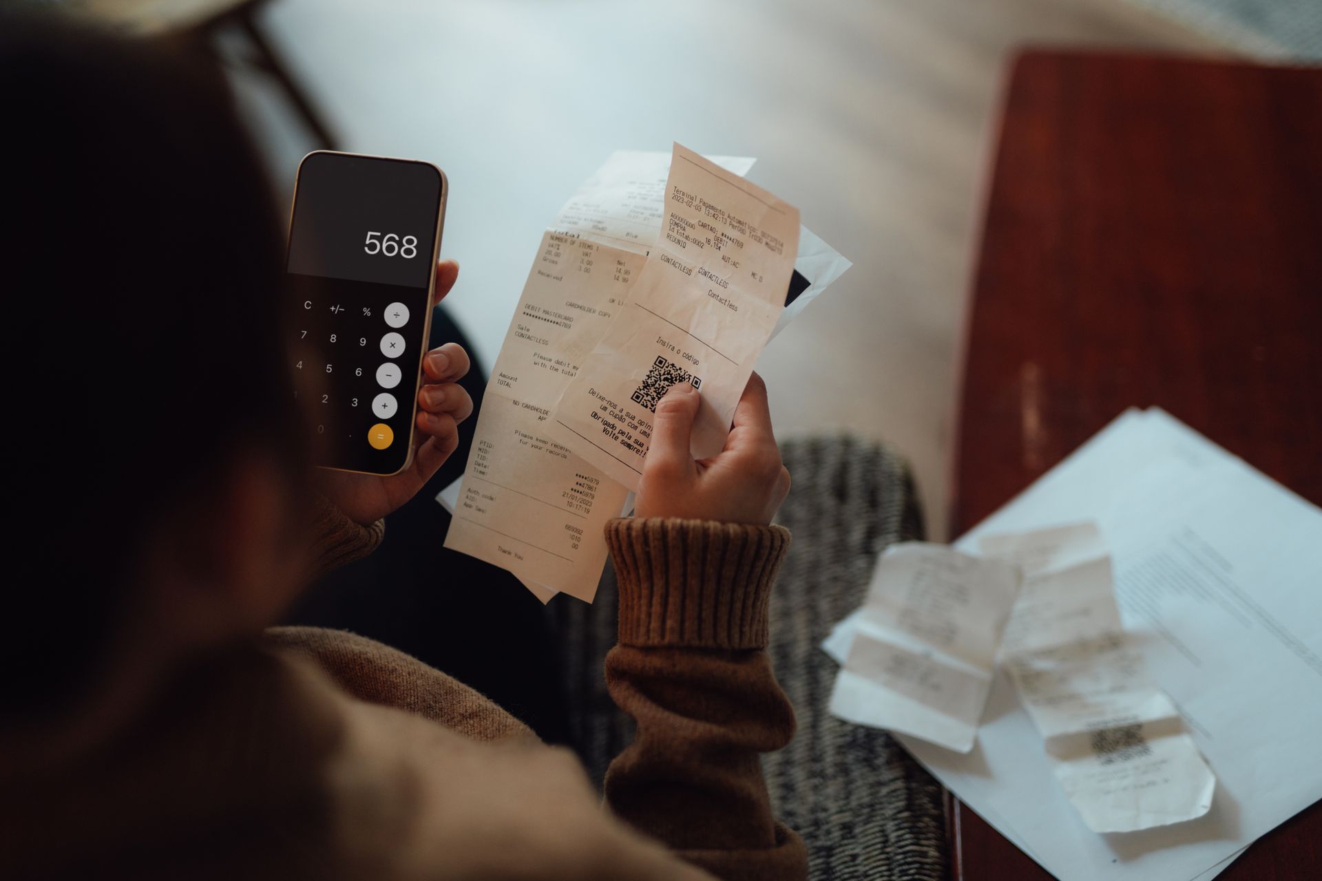 A Person is Holding a Receipt and using a Calculator | Great Bend, KS | P&S Electric