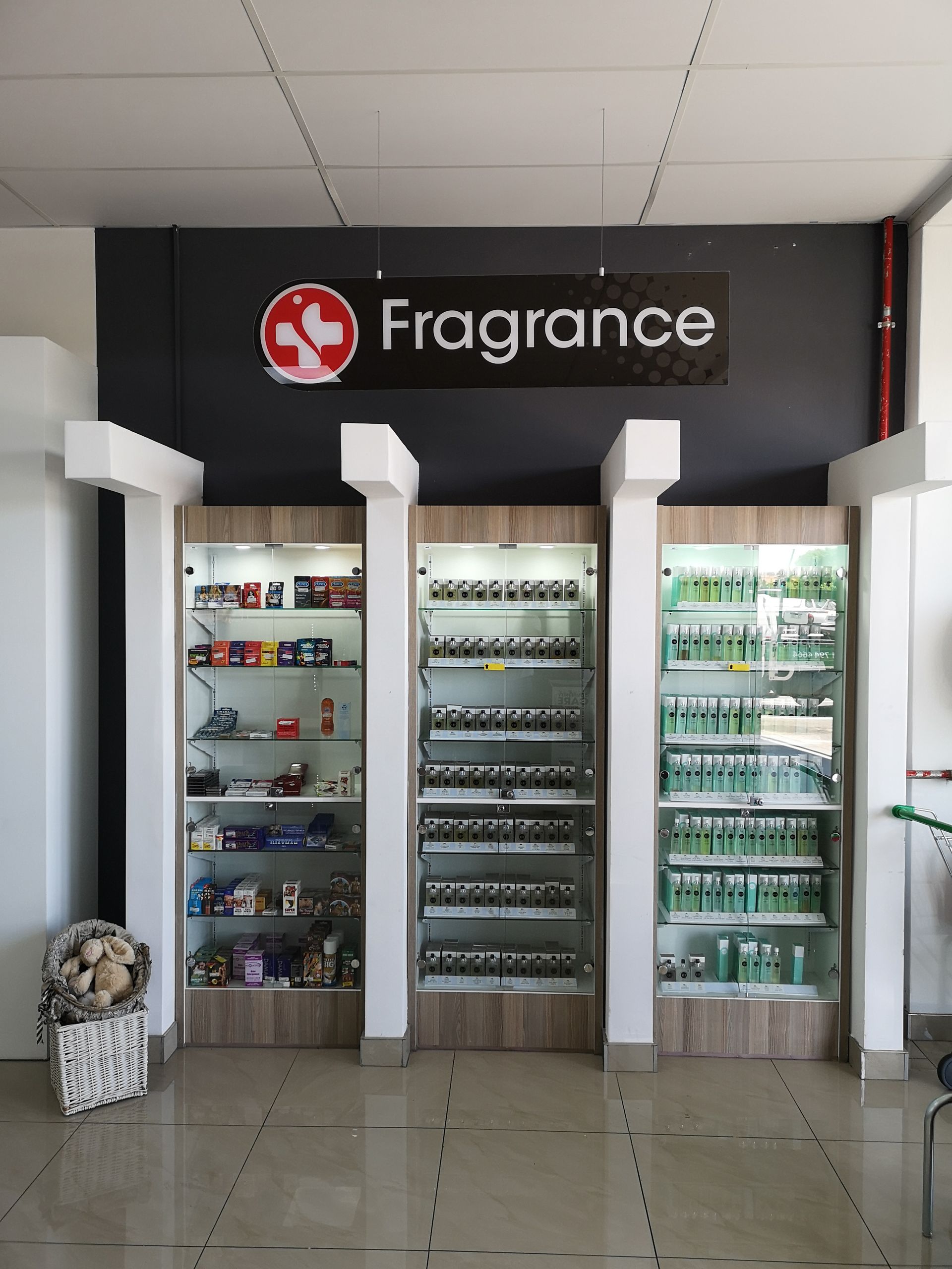 Fragrance display counter with backlit signage