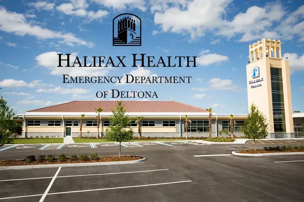 Halifax Health Emergency Department of Deltona building exterior, sunny day, clear sky.