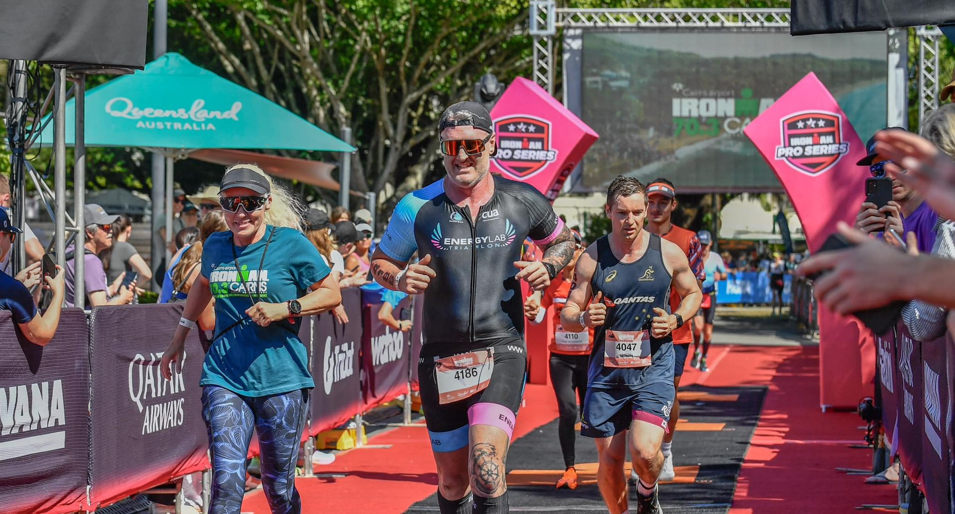 Triathletes Run Towards Finish Line; Red Carpet — Amanda Jade Photography In Gordonvale, QLD