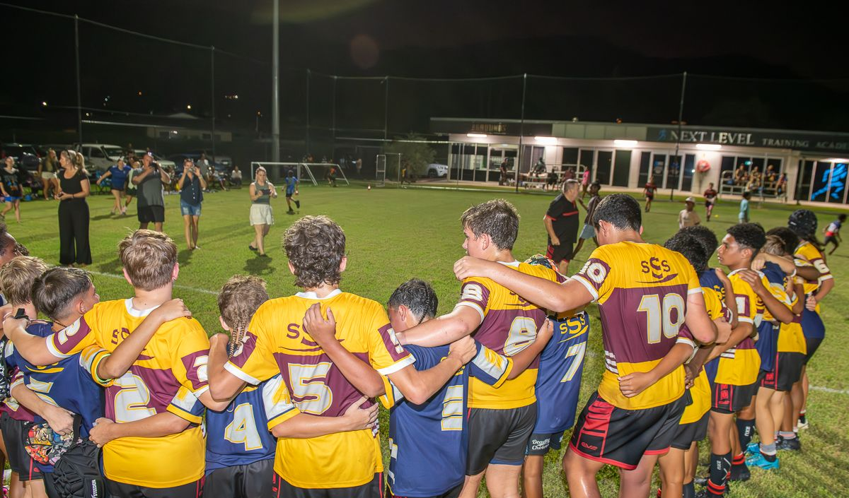 Youth Rugby Team Huddles on a Field — Amanda Jade Photography In Gordonvale, QLD