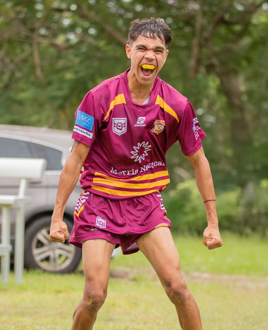A Young Rugby Player In Maroon Jersey Celebrates With A Shout — Amanda Jade Photography In Atherton Tablelands, QLD