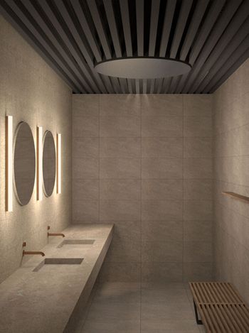 Neutral-toned bathroom with sinks, mirrors, and bench. Modern design with dim lighting.
