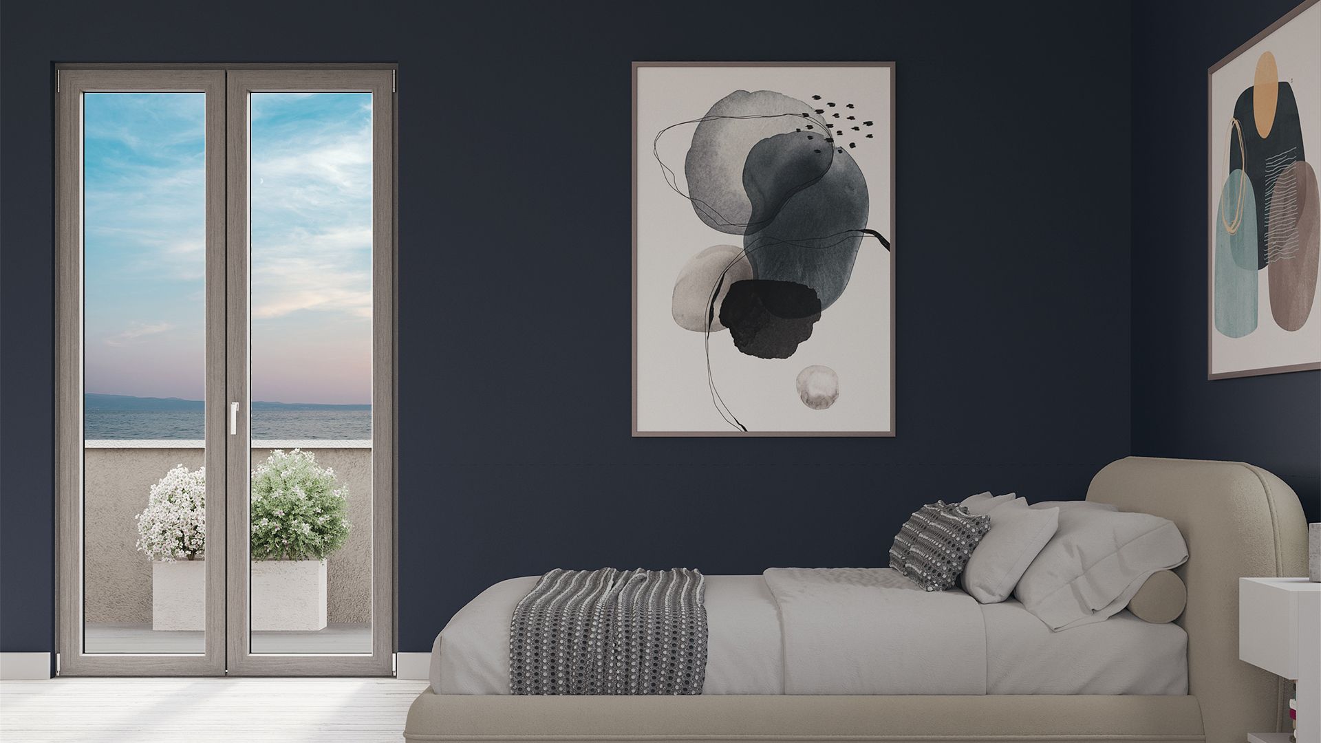 Camera da letto moderna con pareti scure, letto, quadri astratti e porte finestre che si aprono sul mare.