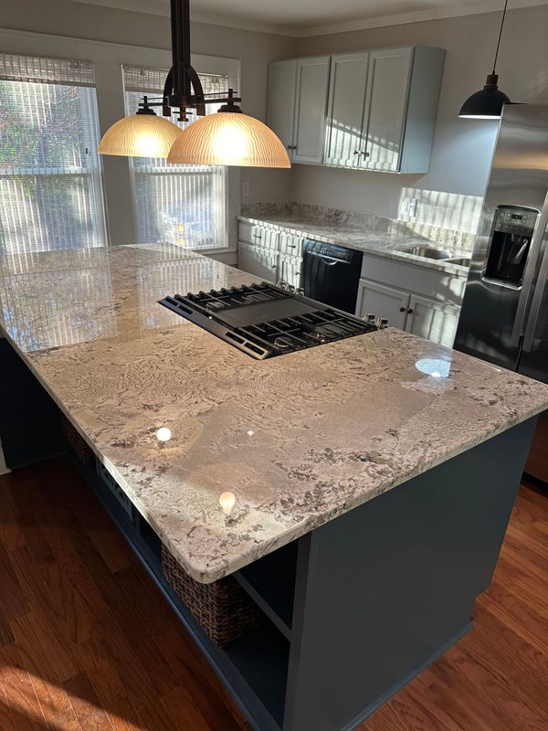 A kitchen with white cabinets, granite countertops, stainless steel appliances. A kitchen with white cabinets, granite countertops, stainless steel appliances.