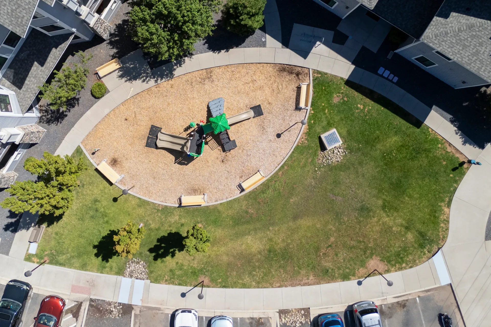 Playground with slides and benches in a residential community at Elevation in Flagstaff, AZ.