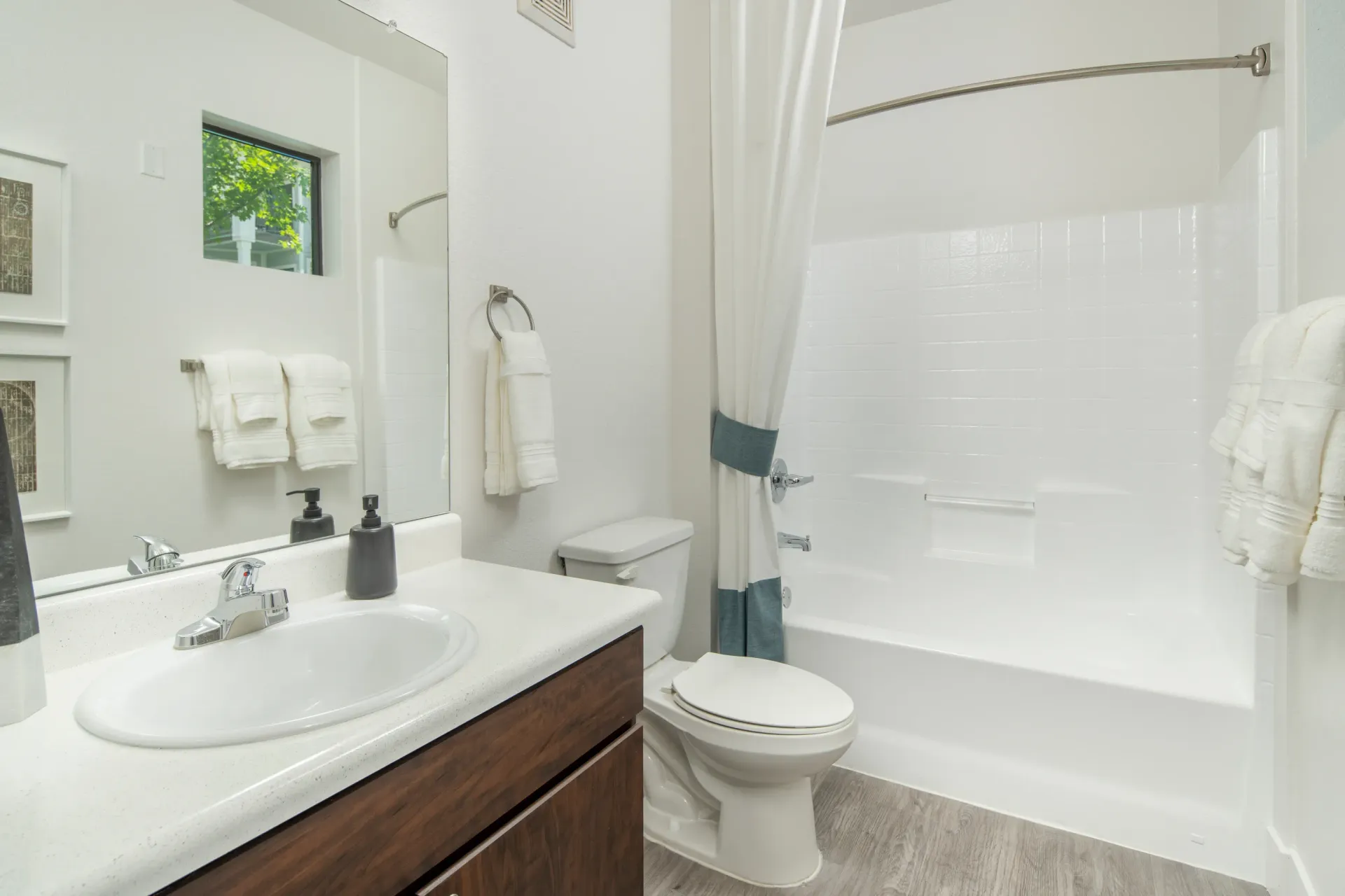 Modern bathroom with vanity, toilet, and shower/tub combo at Elevation in Flagstaff, AZ.
