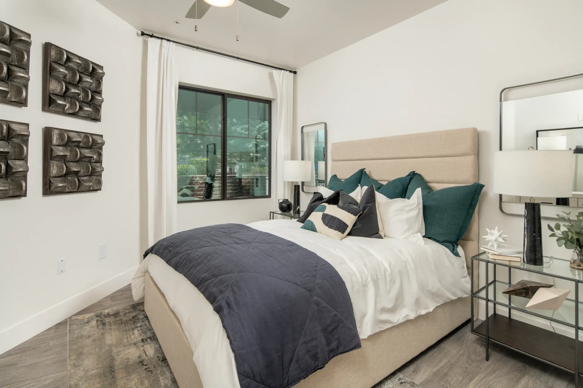 Modern bedroom with king-size bed and abstract wall art at Elevation in Flagstaff, AZ.