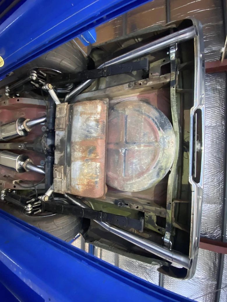 The Bottom of a Blue Car is Shown From Above — Savins Radiator Service In Lismore, NSW