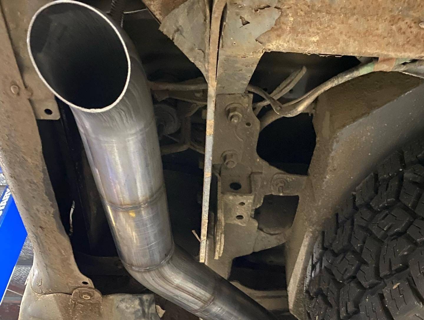 A Close Up of a Exhaust Pipe on the Side of a Car — Savins Radiator Service In Lismore, NSW