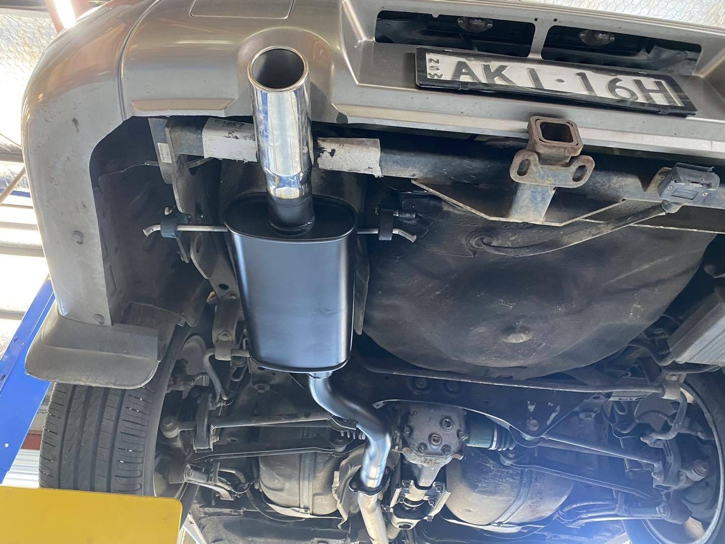 The Underside of a Car With a License Plate — Savins Radiator Service In Lismore, NSW
