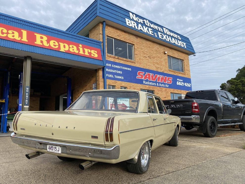 A Car is Parked in Front of a Building — Savins Radiator Service In Lismore, NSW