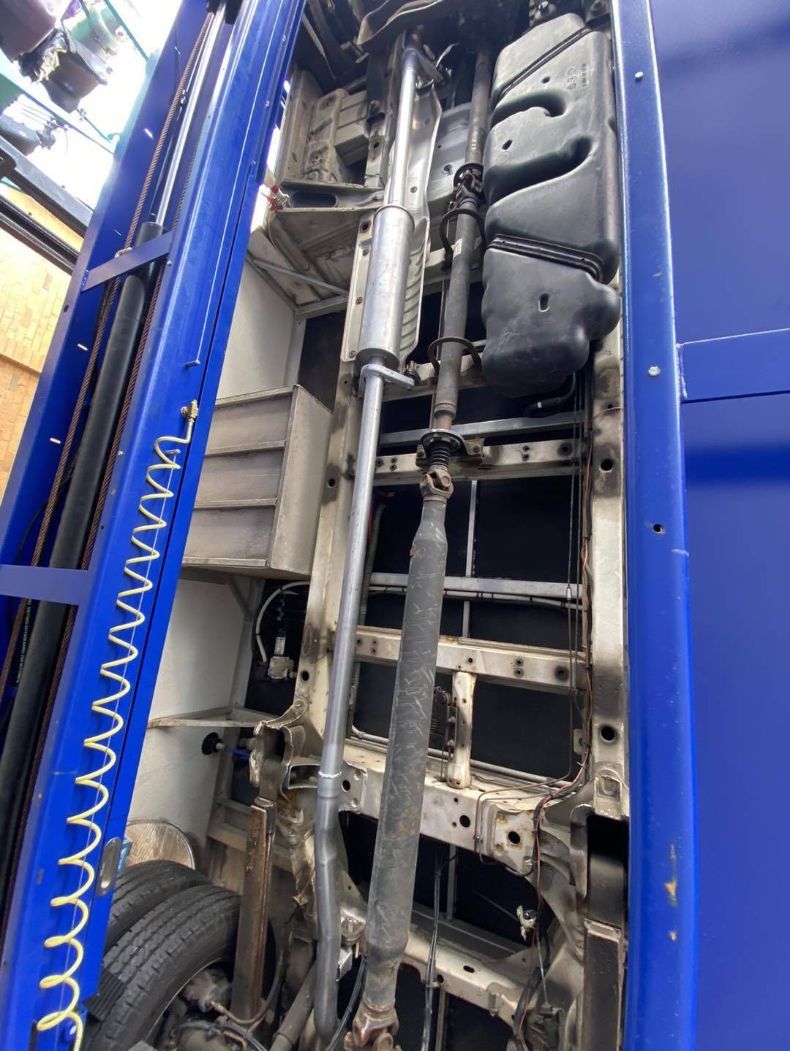The Underside of a Blue Truck With a Hose Attached to It — Savins Radiator Service In Lismore, NSW