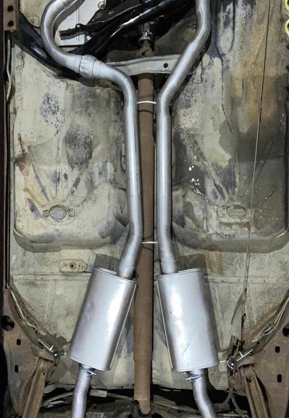 A Close Up of a Exhaust Pipe on the Bottom of a Car — Savins Radiator Service In Lismore, NSW