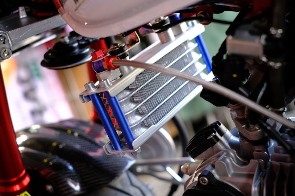 A Close Up of a Motorcycle Engine With a Radiator Attached to It — Savins Radiator Service In Lismore, NSW