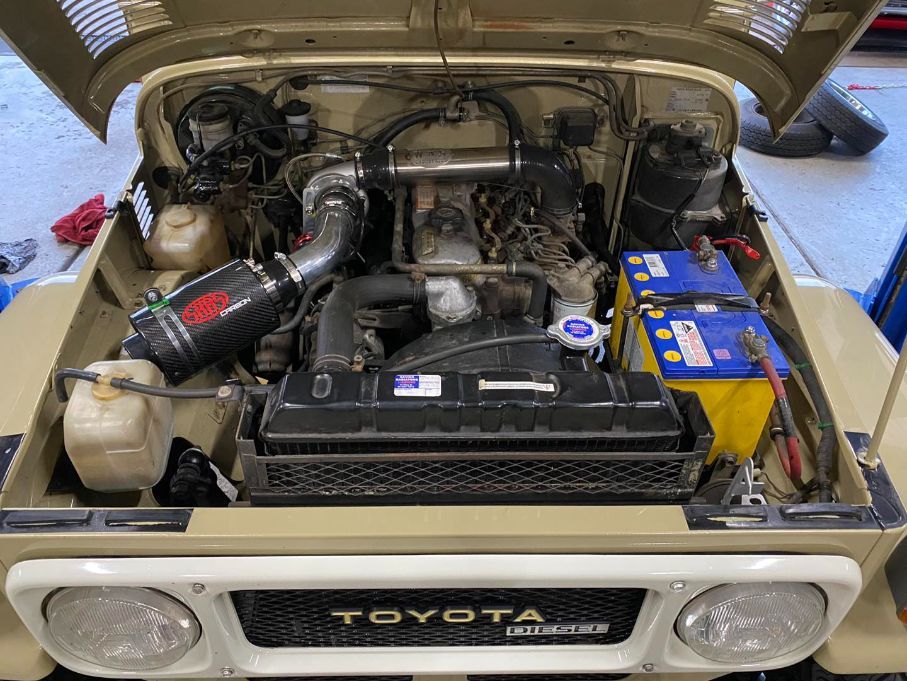 The Engine of a Toyota Land Cruiser is Shown With the Hood Open — Savins Radiator Service In Lismore, NSW