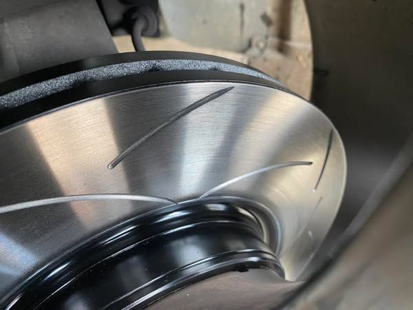 A Close Up of a Brake Disc on a Car — Savins Radiator Service In Lismore, NSW