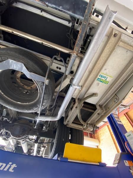 The Underside of a Truck is Shown on a Lift — Savins Radiator Service In Lismore, NSW