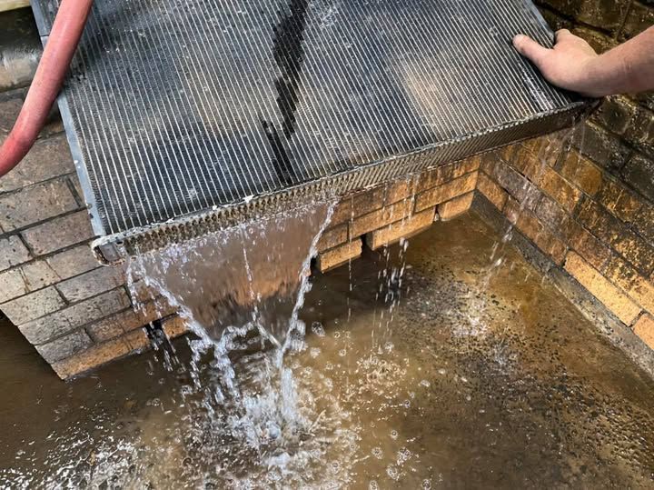 A Person is Pouring Water From a Hose Into a Pool of Water  — Savins Radiator Service In Murwillumbah, NSW