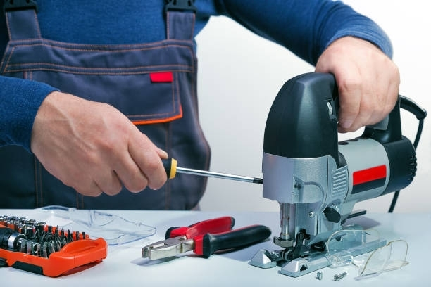 A technician is maintaining a power saw
